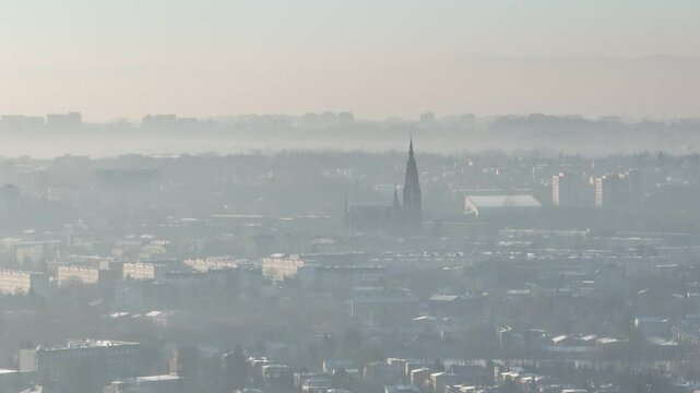 City in the morning fog Aerial shot from a drone. Dabrowa Gornicza in the morning fog.