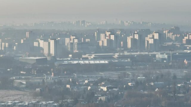 City in the morning fog Aerial shot from a drone. Dabrowa Gornicza in the morning fog.