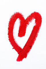 Red heart shape drawn from red lipstick on white background with copy space for Valentine's day and love concept