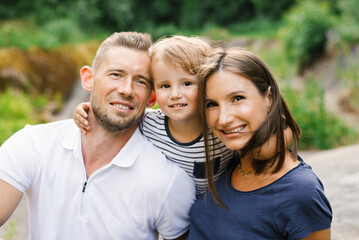 Fototapeta premium Family Sharing Happy Moment In Summer Forest Outdoors