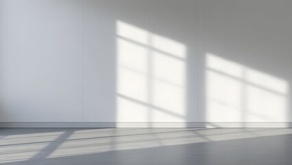 Minimalist empty room with sunlight shadows casting across walls and floor