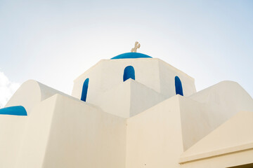 Traditional white church with blue dome on Paros island