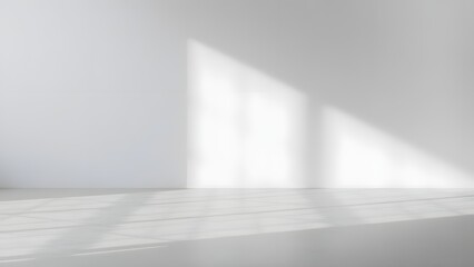 Minimalist white room with window light and shadows creating an aesthetic environment