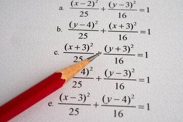 Pencil on mathematic formula exercise test paper in education school.