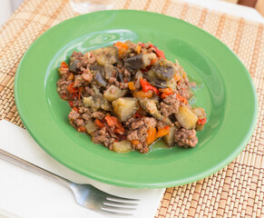 dish of vegetable stew. stewed eggplant, minced meat, carrots, peppers, onion squid