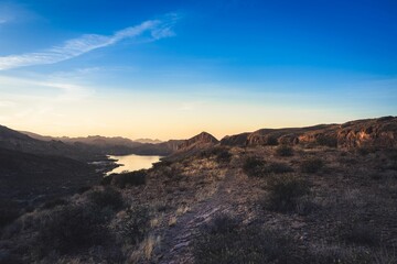 Sunset over Desert Landscape and Mountain Range