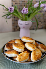 Homemade fried pies in a large plate. Close-up.