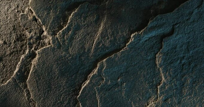 Close-up of cracked rock with layered geological texture