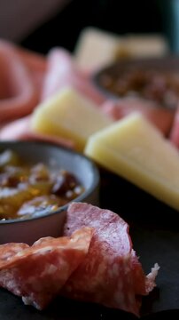 Charcuterie board. Antipasti appetizers of meat and cheese platter with salami, prosciutto crudo or jamon and olives. High quality photo
