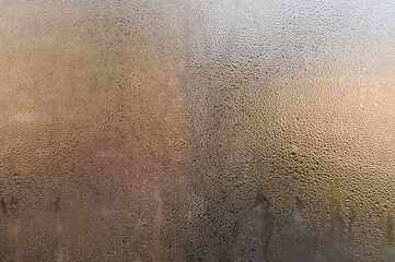 natural condensation forming on cold glass surface. water droplets, creating an abstract pattern....