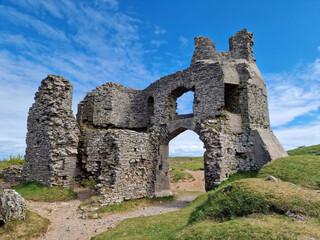 Pennard Castle ruin near the Three Cliffs Bay beach on the Gower Peninsular West Glamorgan Wales UK, which is a popular Welsh coastline travel destination, vacation stock photo image