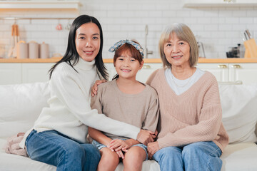 Asian multigenerational family grandmom mother and daughter nephew offspring and granddaughter...