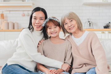 Asian multigenerational family grandmom mother and daughter nephew offspring and granddaughter...