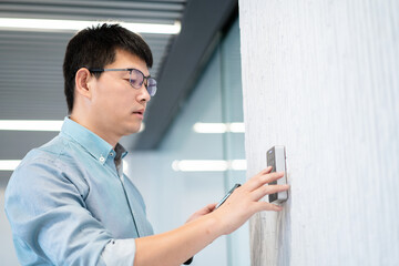 asian businessman open door with password