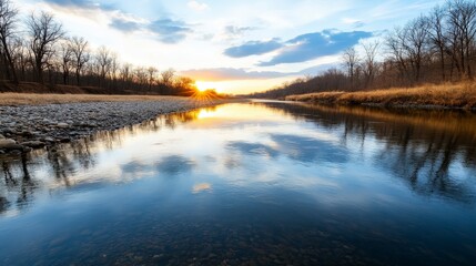 Serene River at Dusk Reflecting Last Light Over Calm Waters Surrounded by Trees and Golden Grasses