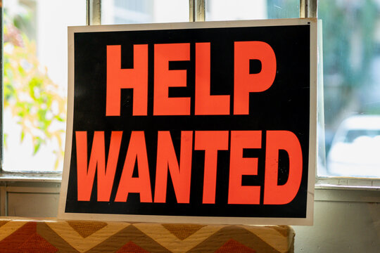 Help wanted sign seeking new employees for job vacancy