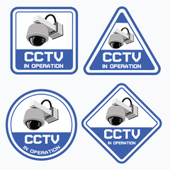 This image displays a set of four CCTV dome camera warning signs in a clean blue and white color scheme. Each sign features a different shape square,triangle,circle,and diamond. 