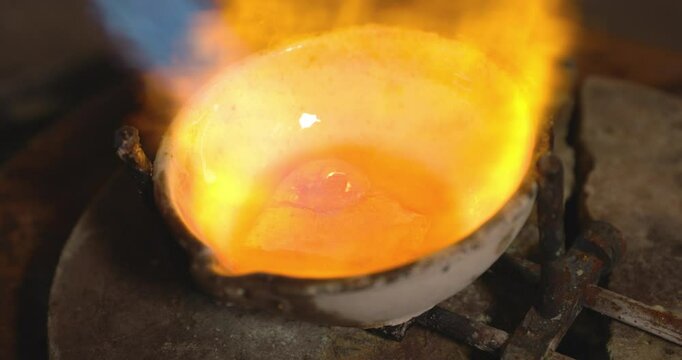 Fire burning and melting gold