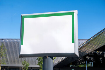 Blank billboard mockup, building roofs background. Advertisement template