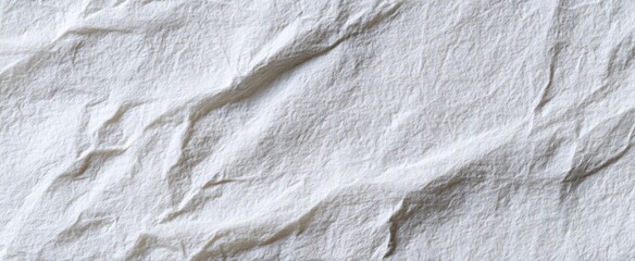 The crumpled white paper background ideal for creative design purposes.