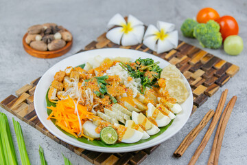 Traditional Indonesian salad made of boiled vegetables, tofu, eggs, and tempeh, served with rich peanut sauce. A flavorful and healthy plant-based dish.