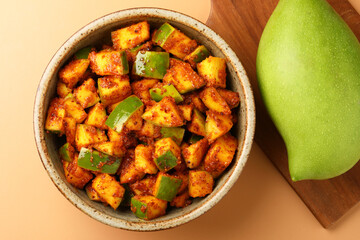 Mango Pickle Homemade Mango Pickle or aam ka achar or achaar in white bowl, selective focus