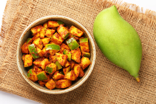 Mango Pickle Homemade Mango Pickle or aam ka achar or achaar in white bowl, selective focus