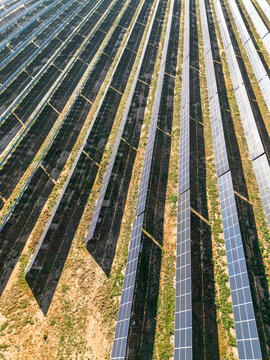 Zaragoza&rsquo;s solar fields viewed from above&mdash;where lines of solar panels carve into the earth, a quiet scene of renewable progress in the Spanish countryside.