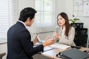 Investment Strategy Discussion. Financial advisor explaining investment options to a client.