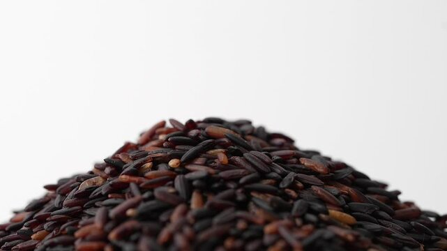 Macro video of black rice kept on rotating disk. Close up video of organic black rice.