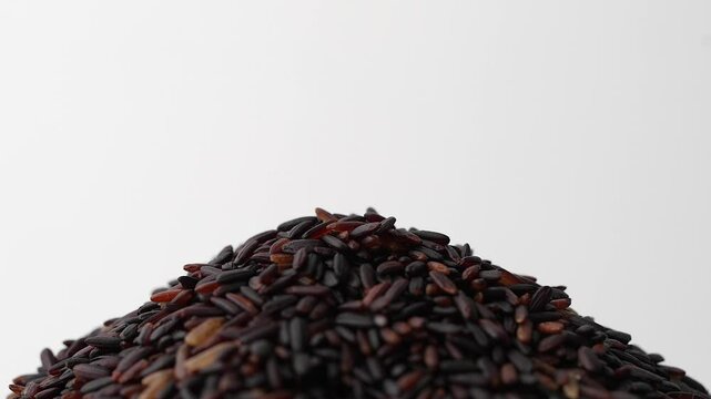 Macro video of black rice kept on rotating disk. Close up video of organic black rice.