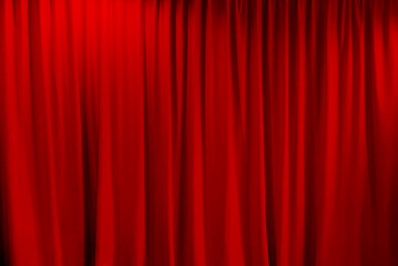 Closed red theater curtain that dropped down as a straight line. Background for inserting text, empty spaces
