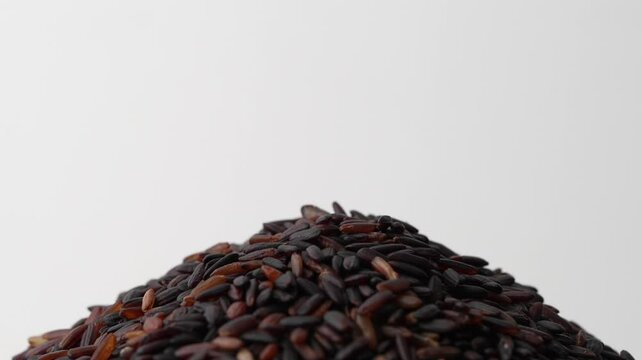 Macro video of black rice kept on rotating disk. Close up video of organic black rice.