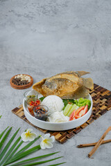 Fried Gourami with rice and sambals