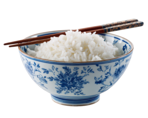 Traditional rice bowl filled with fluffy white rice, accompanied by elegant chopsticks resting on rim. bowl features intricate blue floral patterns, adding touch of elegance to presentation