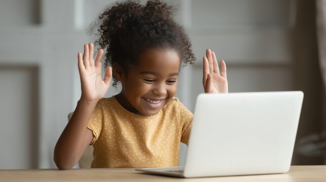 A young deaf black girl student engages in an online video call on his laptop, using sign language while focused on the screen