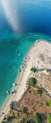 Crystal-clear waters lap at the shores of Zakynthos, where visitors enjoy sunbathing, swimming, and leisurely boat rides. Natural beauty abounds in this Mediterranean paradise