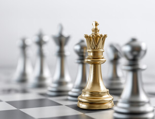 A gold king chess piece stands out from silver pawns on a chessboard against a white background. This image represents a business strategy concept, with a golden and grey color theme.