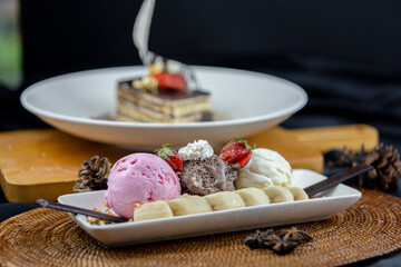 Slice chocolate cake and 3 scope of ice cream