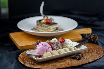 Slice chocolate cake and 3 scope of ice cream