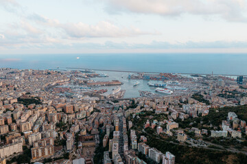Genova italy harbor and cityscape during sunset with ships docked in port