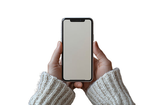 Both hands holding a smartphone with blank screen, person wearing cozy cream knit sweater, isolated on a transparent background