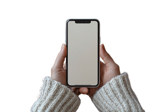Both hands holding a smartphone with blank screen, person wearing cozy cream knit sweater, isolated on a transparent background