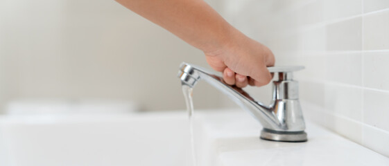 Save water. Little kid keeps turning off the running water in the bathroom to protect environment....