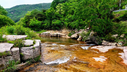 Aerial Drone Footage of a Clear Mountain Stream Flowing Through Mungyeong Countryside in Late Spring and Early Summer, Korea