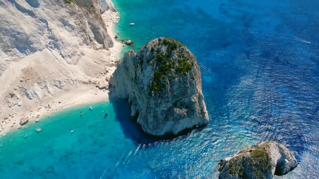 Aerial Shot of White rock near Keri blue lagoon with tourist pleasure boats. Top down view Zakynthos zante island  Greece