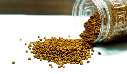 fenugreek seeds or methi dana isolated on white background