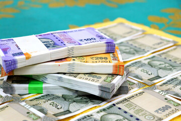 piles of new indian currency notes rupees 50,100,200 and 500