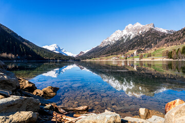 Scenic view of Lake Sufnersee in the Swiss Alps with mountain reflections