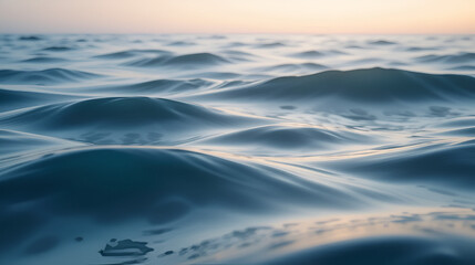 The image captures a serene, ethereal seascape bathed in a soft, dreamy light. Smooth, flowing waves gently undulate across the frame.